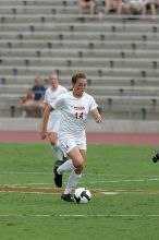 UT senior Kasey Moore (#14, Defender) takes the ball upfield in the second half.  The University of Texas women's soccer team won 2-1 against the Iowa State Cyclones Sunday afternoon, October 5, 2008.

Filename: SRM_20081005_13175061.jpg
Aperture: f/5.6
Shutter Speed: 1/1250
Body: Canon EOS-1D Mark II
Lens: Canon EF 300mm f/2.8 L IS