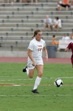 UT senior Kasey Moore (#14, Defender) takes the ball upfield in the second half.  The University of Texas women's soccer team won 2-1 against the Iowa State Cyclones Sunday afternoon, October 5, 2008.

Filename: SRM_20081005_13175263.jpg
Aperture: f/5.6
Shutter Speed: 1/1000
Body: Canon EOS-1D Mark II
Lens: Canon EF 300mm f/2.8 L IS