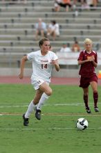 UT senior Kasey Moore (#14, Defender) takes the ball upfield in the second half.  The University of Texas women's soccer team won 2-1 against the Iowa State Cyclones Sunday afternoon, October 5, 2008.

Filename: SRM_20081005_13175264.jpg
Aperture: f/5.6
Shutter Speed: 1/1250
Body: Canon EOS-1D Mark II
Lens: Canon EF 300mm f/2.8 L IS