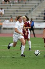 UT senior Kasey Moore (#14, Defender) takes the ball upfield in the second half.  The University of Texas women's soccer team won 2-1 against the Iowa State Cyclones Sunday afternoon, October 5, 2008.

Filename: SRM_20081005_13175266.jpg
Aperture: f/5.6
Shutter Speed: 1/1250
Body: Canon EOS-1D Mark II
Lens: Canon EF 300mm f/2.8 L IS