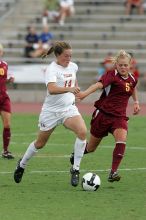 UT senior Kasey Moore (#14, Defender) takes the ball upfield in the second half.  The University of Texas women's soccer team won 2-1 against the Iowa State Cyclones Sunday afternoon, October 5, 2008.

Filename: SRM_20081005_13175469.jpg
Aperture: f/5.6
Shutter Speed: 1/1250
Body: Canon EOS-1D Mark II
Lens: Canon EF 300mm f/2.8 L IS