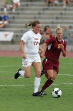 UT senior Kasey Moore (#14, Defender) takes the ball upfield in the second half.  The University of Texas women's soccer team won 2-1 against the Iowa State Cyclones Sunday afternoon, October 5, 2008.

Filename: SRM_20081005_13175470.jpg
Aperture: f/5.6
Shutter Speed: 1/1250
Body: Canon EOS-1D Mark II
Lens: Canon EF 300mm f/2.8 L IS