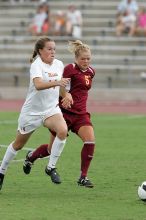 UT senior Kasey Moore (#14, Defender) takes the ball upfield in the second half.  The University of Texas women's soccer team won 2-1 against the Iowa State Cyclones Sunday afternoon, October 5, 2008.

Filename: SRM_20081005_13175473.jpg
Aperture: f/5.6
Shutter Speed: 1/1000
Body: Canon EOS-1D Mark II
Lens: Canon EF 300mm f/2.8 L IS