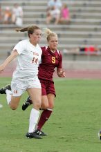 UT senior Kasey Moore (#14, Defender) takes the ball upfield in the second half.  The University of Texas women's soccer team won 2-1 against the Iowa State Cyclones Sunday afternoon, October 5, 2008.

Filename: SRM_20081005_13175474.jpg
Aperture: f/5.6
Shutter Speed: 1/800
Body: Canon EOS-1D Mark II
Lens: Canon EF 300mm f/2.8 L IS