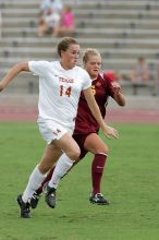 UT senior Kasey Moore (#14, Defender) takes the ball upfield in the second half.  The University of Texas women's soccer team won 2-1 against the Iowa State Cyclones Sunday afternoon, October 5, 2008.

Filename: SRM_20081005_13175675.jpg
Aperture: f/5.6
Shutter Speed: 1/1000
Body: Canon EOS-1D Mark II
Lens: Canon EF 300mm f/2.8 L IS