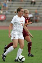UT senior Kasey Moore (#14, Defender) takes the ball upfield in the second half.  The University of Texas women's soccer team won 2-1 against the Iowa State Cyclones Sunday afternoon, October 5, 2008.

Filename: SRM_20081005_13175677.jpg
Aperture: f/5.6
Shutter Speed: 1/1250
Body: Canon EOS-1D Mark II
Lens: Canon EF 300mm f/2.8 L IS