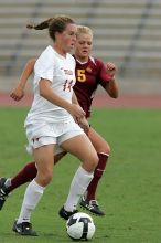 UT senior Kasey Moore (#14, Defender) takes the ball upfield in the second half.  The University of Texas women's soccer team won 2-1 against the Iowa State Cyclones Sunday afternoon, October 5, 2008.

Filename: SRM_20081005_13175679.jpg
Aperture: f/5.6
Shutter Speed: 1/1250
Body: Canon EOS-1D Mark II
Lens: Canon EF 300mm f/2.8 L IS