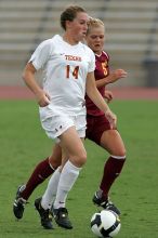 UT senior Kasey Moore (#14, Defender) takes the ball upfield in the second half.  The University of Texas women's soccer team won 2-1 against the Iowa State Cyclones Sunday afternoon, October 5, 2008.

Filename: SRM_20081005_13175681.jpg
Aperture: f/5.6
Shutter Speed: 1/1600
Body: Canon EOS-1D Mark II
Lens: Canon EF 300mm f/2.8 L IS