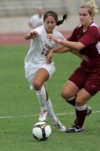 UT sophomore Alisha Ortiz (#12, Forward) in the second half.  The University of Texas women's soccer team won 2-1 against the Iowa State Cyclones Sunday afternoon, October 5, 2008.

Filename: SRM_20081005_13262635.jpg
Aperture: f/5.6
Shutter Speed: 1/1600
Body: Canon EOS-1D Mark II
Lens: Canon EF 300mm f/2.8 L IS