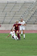 UT sophomore Alisha Ortiz (#12, Forward) slide tackles in the second half.  The University of Texas women's soccer team won 2-1 against the Iowa State Cyclones Sunday afternoon, October 5, 2008.

Filename: SRM_20081005_13441878.jpg
Aperture: f/5.6
Shutter Speed: 1/1600
Body: Canon EOS-1D Mark II
Lens: Canon EF 300mm f/2.8 L IS