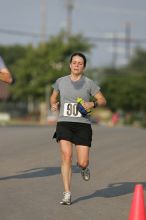 Beth Marek won first place in her age division at the Army Dillo half-marathon and 32K race.

Filename: SRM_20080921_0841363.jpg
Aperture: f/4.0
Shutter Speed: 1/2000
Body: Canon EOS-1D Mark II
Lens: Canon EF 300mm f/2.8 L IS