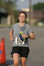 Beth Marek won first place in her age division at the Army Dillo half-marathon and 32K race.

Filename: SRM_20080921_0841402.jpg
Aperture: f/4.0
Shutter Speed: 1/2000
Body: Canon EOS-1D Mark II
Lens: Canon EF 300mm f/2.8 L IS