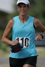 Karen Pearce placed second in her age groun at the Army Dillo half-marathon and 32K race.

Filename: SRM_20080921_1056483.jpg
Aperture: f/4.0
Shutter Speed: 1/2500
Body: Canon EOS-1D Mark II
Lens: Canon EF 300mm f/2.8 L IS