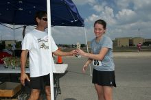 Beth Marek won first place in her age division at the Army Dillo half-marathon and 32K race.

Filename: SRM_20080921_1202082.jpg
Aperture: f/10.0
Shutter Speed: 1/250
Body: Canon EOS-1D Mark II
Lens: Canon EF 16-35mm f/2.8 L