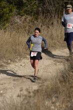 Beth Marek placed 5th in her age group in the 25K at the. Bandera 25K, 50K, and 100K trail race in Bandera, TX on Saturday, January 10, 2009.

Filename: SRM_20090110_10174091.jpg
Aperture: f/5.6
Shutter Speed: 1/800
Body: Canon EOS-1D Mark II
Lens: Canon EF 300mm f/2.8 L IS