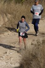 Beth Marek placed 5th in her age group in the 25K at the. Bandera 25K, 50K, and 100K trail race in Bandera, TX on Saturday, January 10, 2009.

Filename: SRM_20090110_10174694.jpg
Aperture: f/5.6
Shutter Speed: 1/1000
Body: Canon EOS-1D Mark II
Lens: Canon EF 300mm f/2.8 L IS