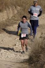 Beth Marek placed 5th in her age group in the 25K at the. Bandera 25K, 50K, and 100K trail race in Bandera, TX on Saturday, January 10, 2009.

Filename: SRM_20090110_10175497.jpg
Aperture: f/5.6
Shutter Speed: 1/1000
Body: Canon EOS-1D Mark II
Lens: Canon EF 300mm f/2.8 L IS