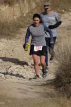 Beth Marek placed 5th in her age group in the 25K at the. Bandera 25K, 50K, and 100K trail race in Bandera, TX on Saturday, January 10, 2009.

Filename: SRM_20090110_10175698.jpg
Aperture: f/5.6
Shutter Speed: 1/1000
Body: Canon EOS-1D Mark II
Lens: Canon EF 300mm f/2.8 L IS