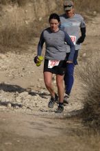 Beth Marek placed 5th in her age group in the 25K at the. Bandera 25K, 50K, and 100K trail race in Bandera, TX on Saturday, January 10, 2009.

Filename: SRM_20090110_10180000.jpg
Aperture: f/5.6
Shutter Speed: 1/1250
Body: Canon EOS-1D Mark II
Lens: Canon EF 300mm f/2.8 L IS