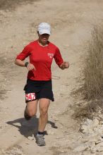 Meredith Terranova placed second overall in the 50K at the Bandera 25K, 50K, and 100K trail race in Bandera, TX on Saturday, January 10, 2009.

Filename: SRM_20090110_12422427.jpg
Aperture: f/5.6
Shutter Speed: 1/1250
Body: Canon EOS-1D Mark II
Lens: Canon EF 300mm f/2.8 L IS