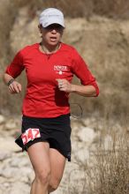 Meredith Terranova placed second overall in the 50K at the Bandera 25K, 50K, and 100K trail race in Bandera, TX on Saturday, January 10, 2009.

Filename: SRM_20090110_12423431.jpg
Aperture: f/5.6
Shutter Speed: 1/1000
Body: Canon EOS-1D Mark II
Lens: Canon EF 300mm f/2.8 L IS