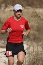 Meredith Terranova placed second overall in the 50K at the Bandera 25K, 50K, and 100K trail race in Bandera, TX on Saturday, January 10, 2009.

Filename: SRM_20090110_12423432.jpg
Aperture: f/5.6
Shutter Speed: 1/1000
Body: Canon EOS-1D Mark II
Lens: Canon EF 300mm f/2.8 L IS