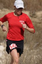 Meredith Terranova placed second overall in the 50K at the Bandera 25K, 50K, and 100K trail race in Bandera, TX on Saturday, January 10, 2009.

Filename: SRM_20090110_12423633.jpg
Aperture: f/5.6
Shutter Speed: 1/800
Body: Canon EOS-1D Mark II
Lens: Canon EF 300mm f/2.8 L IS