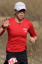 Meredith Terranova placed second overall in the 50K at the Bandera 25K, 50K, and 100K trail race in Bandera, TX on Saturday, January 10, 2009.

Filename: SRM_20090110_12424035.jpg
Aperture: f/5.6
Shutter Speed: 1/800
Body: Canon EOS-1D Mark II
Lens: Canon EF 300mm f/2.8 L IS