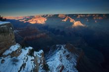 First sunrise of the new year at the south rim of the Grand Canyon, Thursday January 1, 2009.  The temperature was as low as 15 F the night before with a foot and a half of snow on the ground.  Luckily sunrise wasn't until 7:40.

Filename: SRM_20090101_07535121.JPG
Aperture: f/16.0
Shutter Speed: 6/10
Body: Canon EOS-1D Mark II
Lens: Canon EF 16-35mm f/2.8 L