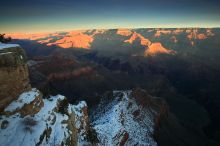 First sunrise of the new year at the south rim of the Grand Canyon, Thursday January 1, 2009.  The temperature was as low as 15 F the night before with a foot and a half of snow on the ground.  Luckily sunrise wasn't until 7:40.

Filename: SRM_20090101_07540222.JPG
Aperture: f/16.0
Shutter Speed: 6/10
Body: Canon EOS-1D Mark II
Lens: Canon EF 16-35mm f/2.8 L