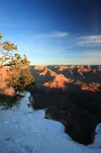 First sunrise of the new year at the south rim of the Grand Canyon, Thursday January 1, 2009.  The temperature was as low as 15 F the night before with a foot and a half of snow on the ground.  Luckily sunrise wasn't until 7:40.

Filename: SRM_20090101_08050836.JPG
Aperture: f/14.0
Shutter Speed: 1/6
Body: Canon EOS-1D Mark II
Lens: Canon EF 16-35mm f/2.8 L