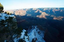 First sunrise of the new year at the south rim of the Grand Canyon, Thursday January 1, 2009.  The temperature was as low as 15 F the night before with a foot and a half of snow on the ground.  Luckily sunrise wasn't until 7:40.

Filename: SRM_20090101_08074038.JPG
Aperture: f/16.0
Shutter Speed: 1/8
Body: Canon EOS-1D Mark II
Lens: Canon EF 16-35mm f/2.8 L