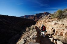 Beth Marek hiking down the South Kaibab trail, backpacking the Grand Canyon with Beth, Thursday, January 1, 2009.

Filename: SRM_20090101_15230177.jpg
Aperture: f/11.0
Shutter Speed: 1/80
Body: Canon EOS-1D Mark II
Lens: Canon EF 16-35mm f/2.8 L