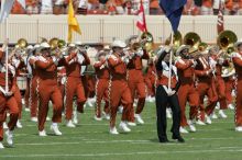 The UT marching band takes the field before the Arkansas football game.  The University of Texas football team defeated the Arkansas Razorbacks with a score of 52-10 in Austin, TX on Saturday, September 27, 2008.

Filename: SRM_20080927_14193413.jpg
Aperture: f/5.6
Shutter Speed: 1/1600
Body: Canon EOS-1D Mark II
Lens: Canon EF 300mm f/2.8 L IS