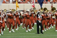 The UT marching band takes the field before the Arkansas football game.  The University of Texas football team defeated the Arkansas Razorbacks with a score of 52-10 in Austin, TX on Saturday, September 27, 2008.

Filename: SRM_20080927_14193413.jpg
Aperture: f/5.6
Shutter Speed: 1/1600
Body: Canon EOS-1D Mark II
Lens: Canon EF 300mm f/2.8 L IS