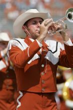 The UT marching band takes the field before the Arkansas football game.  The University of Texas football team defeated the Arkansas Razorbacks with a score of 52-10 in Austin, TX on Saturday, September 27, 2008.

Filename: SRM_20080927_14203033.jpg
Aperture: f/5.6
Shutter Speed: 1/1600
Body: Canon EOS-1D Mark II
Lens: Canon EF 300mm f/2.8 L IS