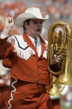 The UT marching band takes the field before the Arkansas football game.  The University of Texas football team defeated the Arkansas Razorbacks with a score of 52-10 in Austin, TX on Saturday, September 27, 2008.

Filename: SRM_20080927_14203235.jpg
Aperture: f/5.6
Shutter Speed: 1/1600
Body: Canon EOS-1D Mark II
Lens: Canon EF 300mm f/2.8 L IS