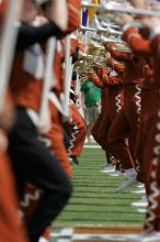 The UT marching band takes the field before the Arkansas football game.  The University of Texas football team defeated the Arkansas Razorbacks with a score of 52-10 in Austin, TX on Saturday, September 27, 2008.

Filename: SRM_20080927_14205643.jpg
Aperture: f/5.6
Shutter Speed: 1/1250
Body: Canon EOS-1D Mark II
Lens: Canon EF 300mm f/2.8 L IS