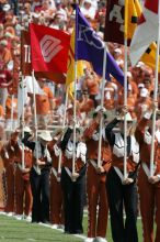 The UT marching band takes the field before the Arkansas football game.  The University of Texas football team defeated the Arkansas Razorbacks with a score of 52-10 in Austin, TX on Saturday, September 27, 2008.

Filename: SRM_20080927_14214246.jpg
Aperture: f/5.6
Shutter Speed: 1/1250
Body: Canon EOS-1D Mark II
Lens: Canon EF 300mm f/2.8 L IS