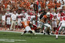 The University of Texas football team defeated the Arkansas Razorbacks with a score of 52-10 in Austin, TX on Saturday, September 27, 2008.

Filename: SRM_20080927_14400280.jpg
Aperture: f/5.6
Shutter Speed: 1/4000
Body: Canon EOS-1D Mark II
Lens: Canon EF 300mm f/2.8 L IS