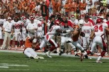 The University of Texas football team defeated the Arkansas Razorbacks with a score of 52-10 in Austin, TX on Saturday, September 27, 2008.

Filename: SRM_20080927_14400281.jpg
Aperture: f/5.6
Shutter Speed: 1/4000
Body: Canon EOS-1D Mark II
Lens: Canon EF 300mm f/2.8 L IS