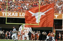 Texas Cheerleaders.  The University of Texas football team defeated the Arkansas Razorbacks with a score of 52-10 in Austin, TX on Saturday, September 27, 2008.

Filename: SRM_20080927_14425802.jpg
Aperture: f/5.6
Shutter Speed: 1/2500
Body: Canon EOS-1D Mark II
Lens: Canon EF 300mm f/2.8 L IS