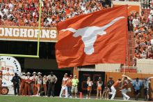 Texas Cheerleaders.  The University of Texas football team defeated the Arkansas Razorbacks with a score of 52-10 in Austin, TX on Saturday, September 27, 2008.

Filename: SRM_20080927_14425803.jpg
Aperture: f/5.6
Shutter Speed: 1/2500
Body: Canon EOS-1D Mark II
Lens: Canon EF 300mm f/2.8 L IS