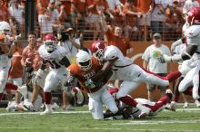 The University of Texas football team defeated the Arkansas Razorbacks with a score of 52-10 in Austin, TX on Saturday, September 27, 2008.

Filename: SRM_20080927_15121823.jpg
Aperture: f/5.6
Shutter Speed: 1/1250
Body: Canon EOS-1D Mark II
Lens: Canon EF 300mm f/2.8 L IS