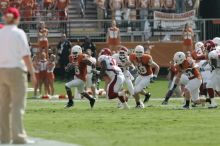 The University of Texas football team defeated the Arkansas Razorbacks with a score of 52-10 in Austin, TX on Saturday, September 27, 2008.

Filename: SRM_20080927_15332813.jpg
Aperture: f/5.6
Shutter Speed: 1/2000
Body: Canon EOS-1D Mark II
Lens: Canon EF 300mm f/2.8 L IS