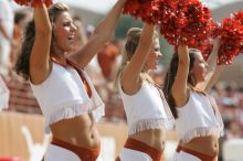 Texas Pom.  The University of Texas football team defeated the Arkansas Razorbacks with a score of 52-10 in Austin, TX on Saturday, September 27, 2008.

Filename: SRM_20080927_15375460.jpg
Aperture: f/5.6
Shutter Speed: 1/1250
Body: Canon EOS-1D Mark II
Lens: Canon EF 300mm f/2.8 L IS