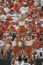 Texas Cheerleaders.  The University of Texas football team defeated the Arkansas Razorbacks with a score of 52-10 in Austin, TX on Saturday, September 27, 2008.

Filename: SRM_20080927_15480885.jpg
Aperture: f/5.6
Shutter Speed: 1/1000
Body: Canon EOS-1D Mark II
Lens: Canon EF 300mm f/2.8 L IS