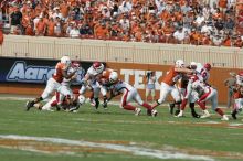 The University of Texas football team defeated the Arkansas Razorbacks with a score of 52-10 in Austin, TX on Saturday, September 27, 2008.

Filename: SRM_20080927_16262626.jpg
Aperture: f/5.0
Shutter Speed: 1/3200
Body: Canon EOS-1D Mark II
Lens: Canon EF 300mm f/2.8 L IS