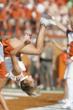 Texas Cheerleaders.  The University of Texas football team defeated the Arkansas Razorbacks with a score of 52-10 in Austin, TX on Saturday, September 27, 2008.

Filename: SRM_20080927_16313487.jpg
Aperture: f/5.0
Shutter Speed: 1/2500
Body: Canon EOS-1D Mark II
Lens: Canon EF 300mm f/2.8 L IS