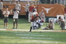 The University of Texas football team defeated the Arkansas Razorbacks with a score of 52-10 in Austin, TX on Saturday, September 27, 2008.

Filename: SRM_20080927_17073042.jpg
Aperture: f/5.6
Shutter Speed: 1/1000
Body: Canon EOS-1D Mark II
Lens: Canon EF 300mm f/2.8 L IS